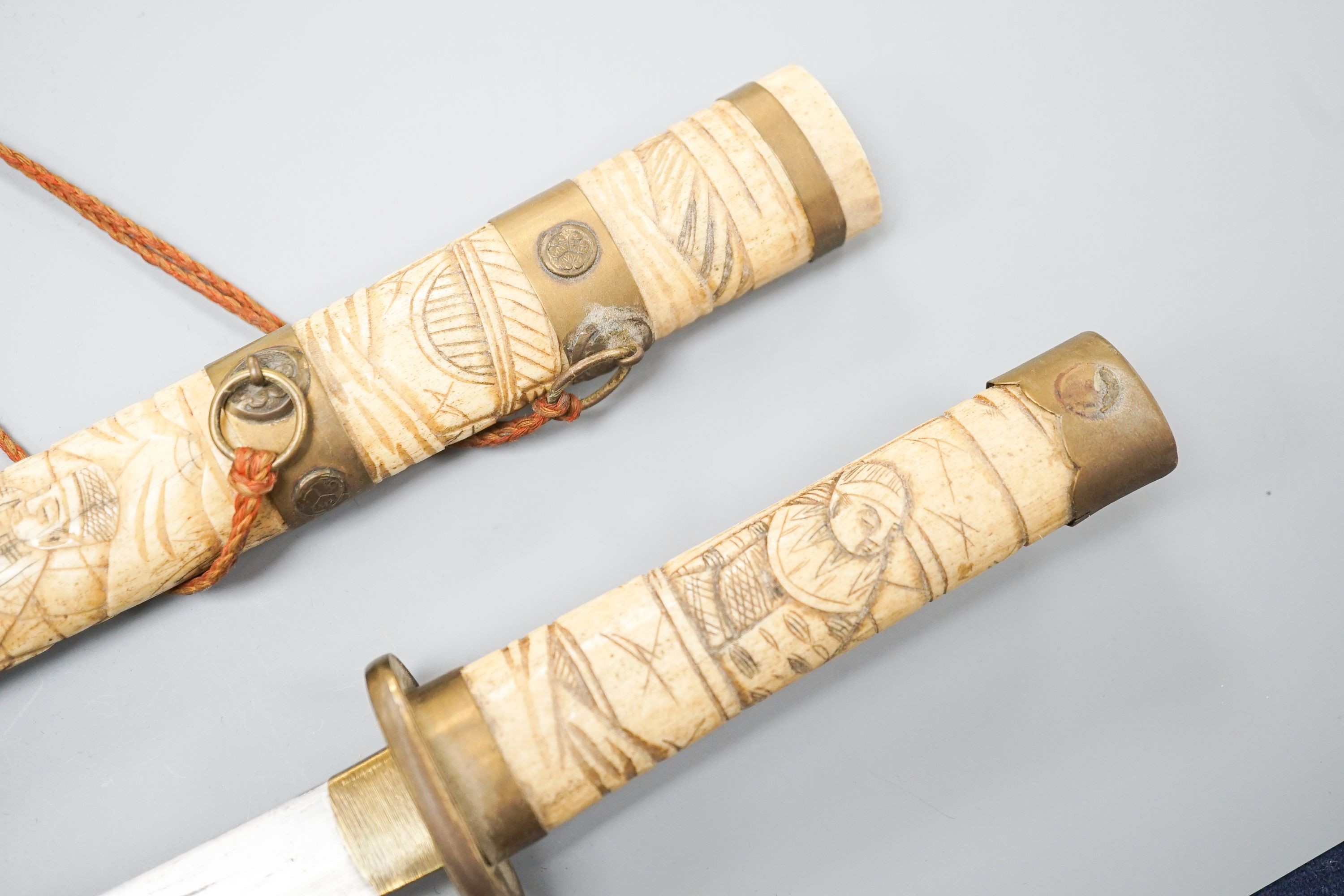 A 20th century bone and brass mounted tanto sword